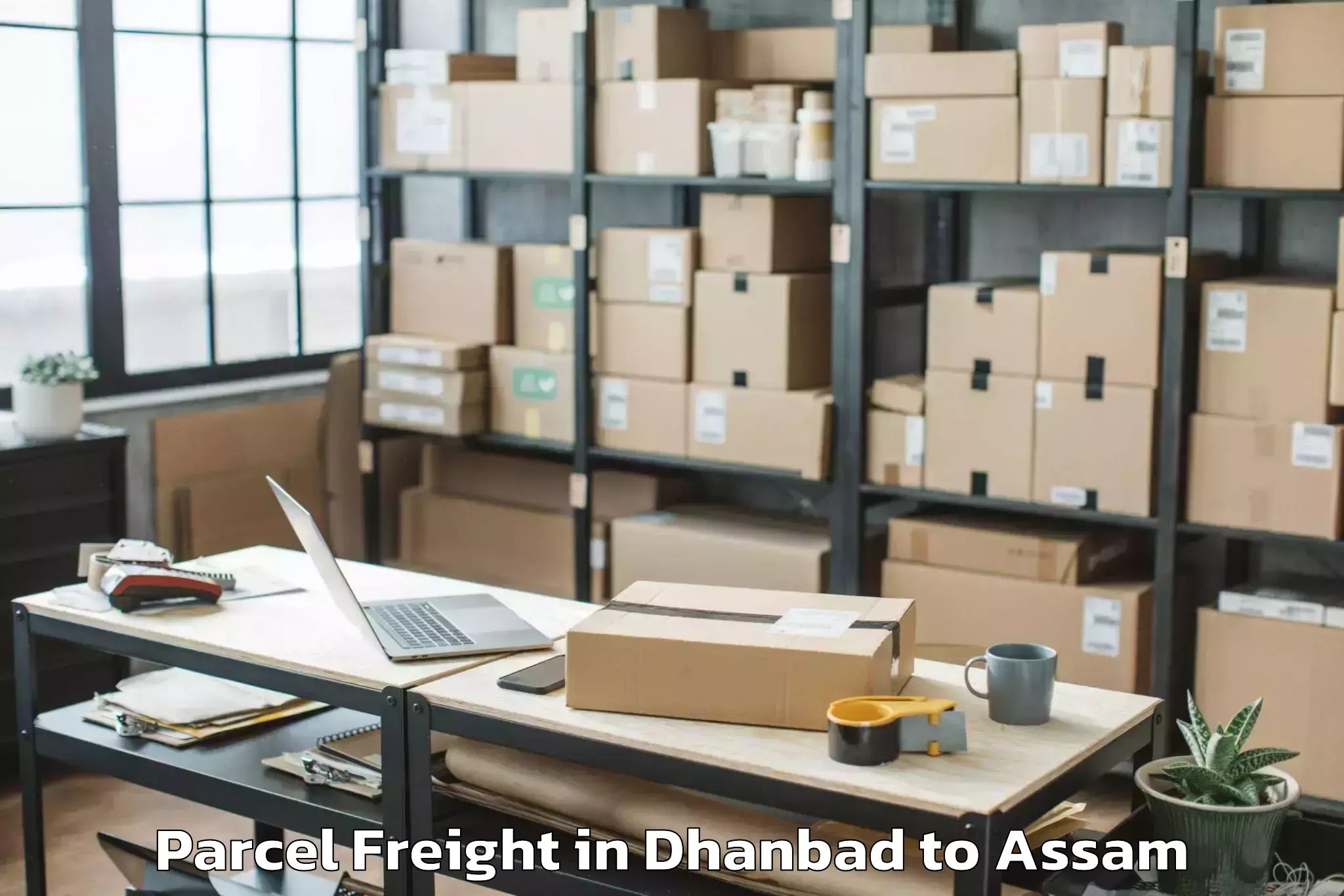 Leading Dhanbad to Patharighat Parcel Freight Provider